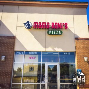 Modern building exterior featuring illuminated Channel Letters signage with updated branding to support a successful corporate rebranding project.